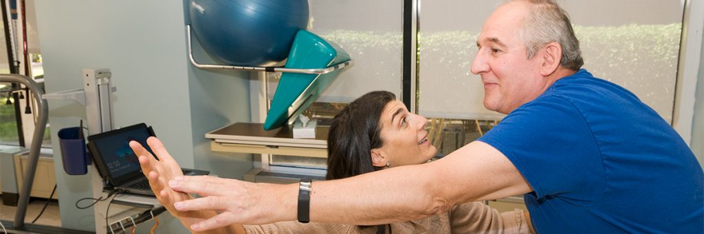 Occupational Therapist working with patient during orthopedic occupational therapy