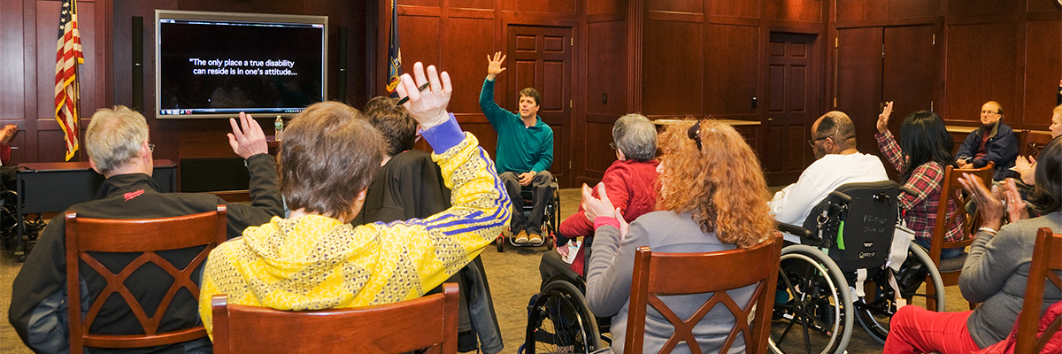 Speaker talking during a support group meeting at Helen Hayes Hospital