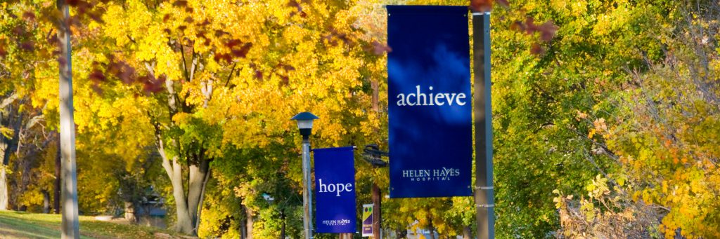 "achieve" and "hope" banners on Helen Hayes Hospital campus