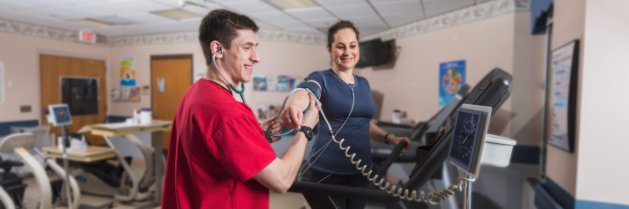 Exercise physiologist checking blood pressure