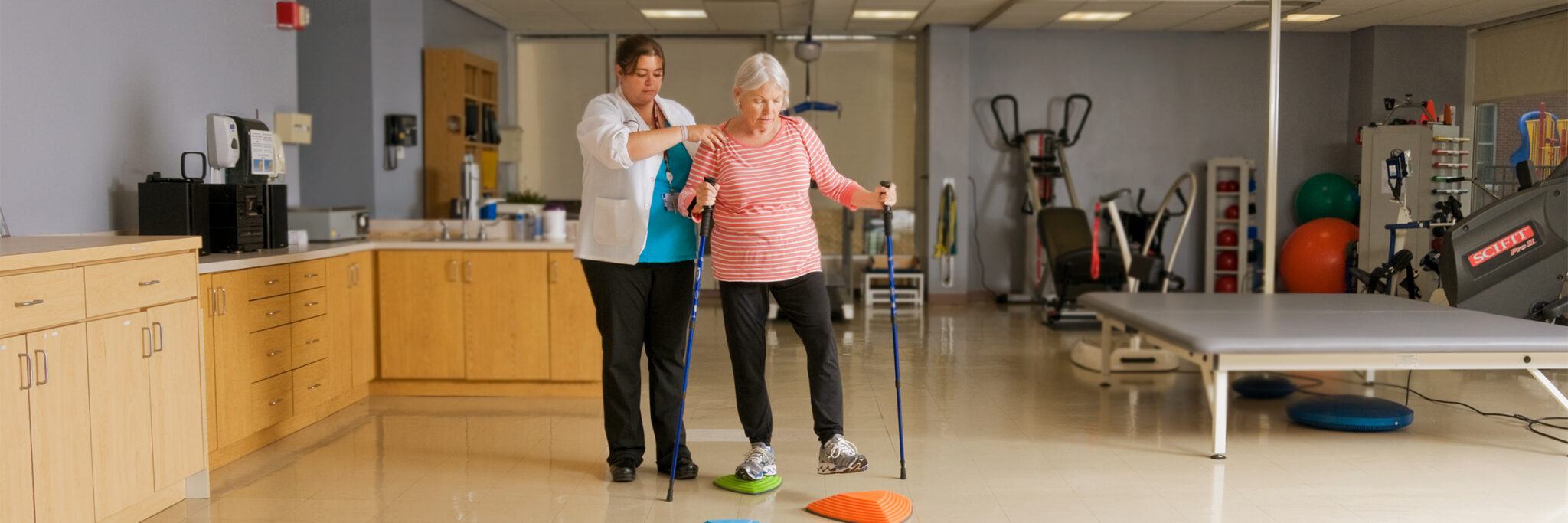 Physical therapist assisting patient with Outpatient Neurological Physical Therapy exercise