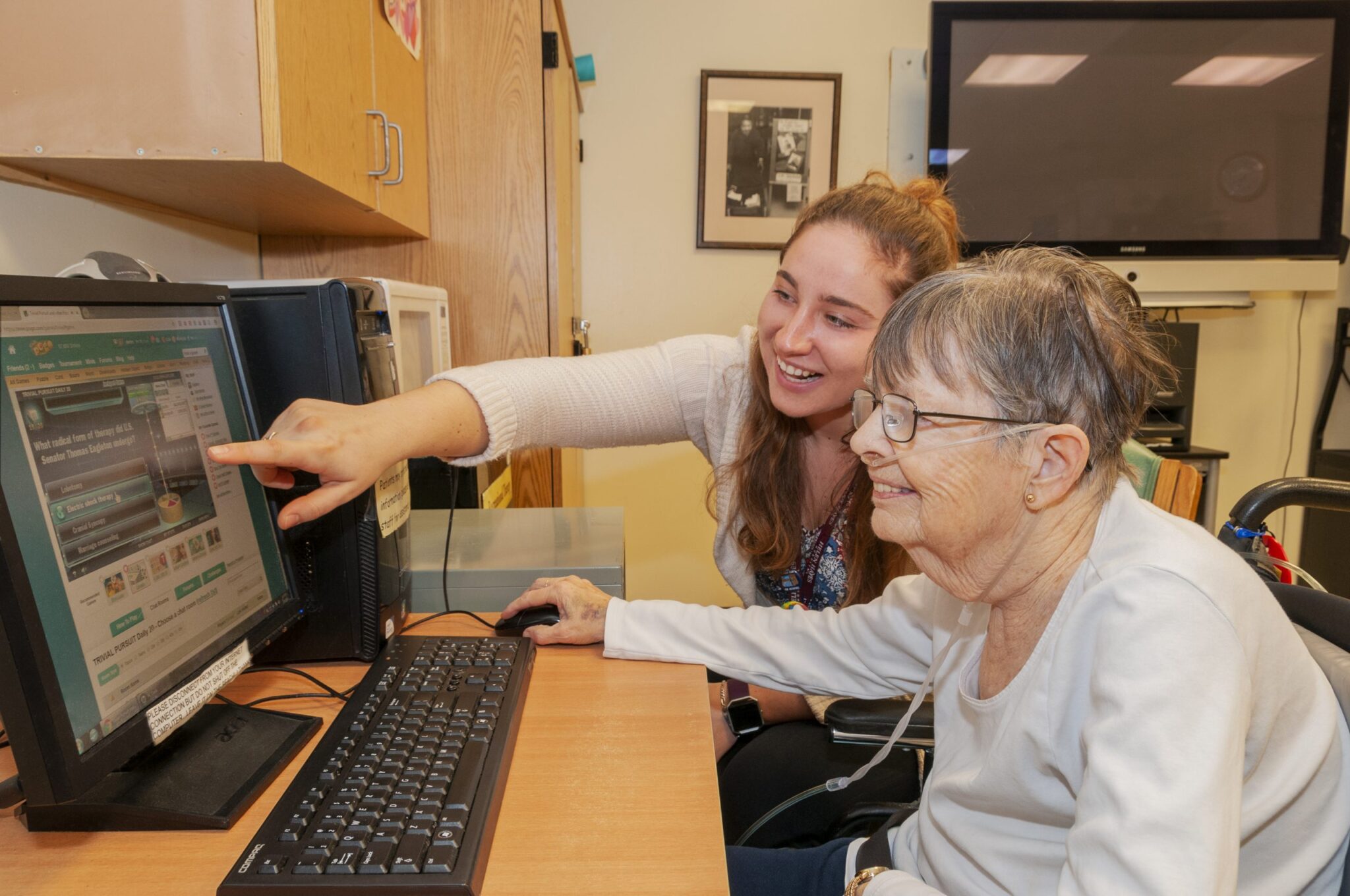 Recreational Therapist conducting exercise with patient