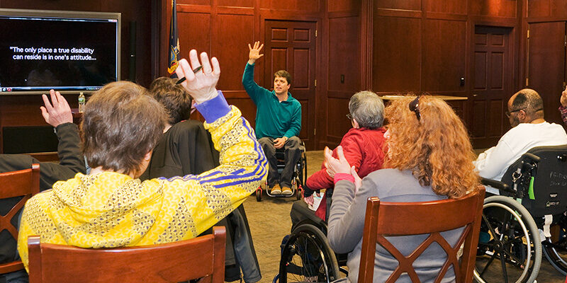 Speaker talking during a support group meeting at Helen Hayes Hospital